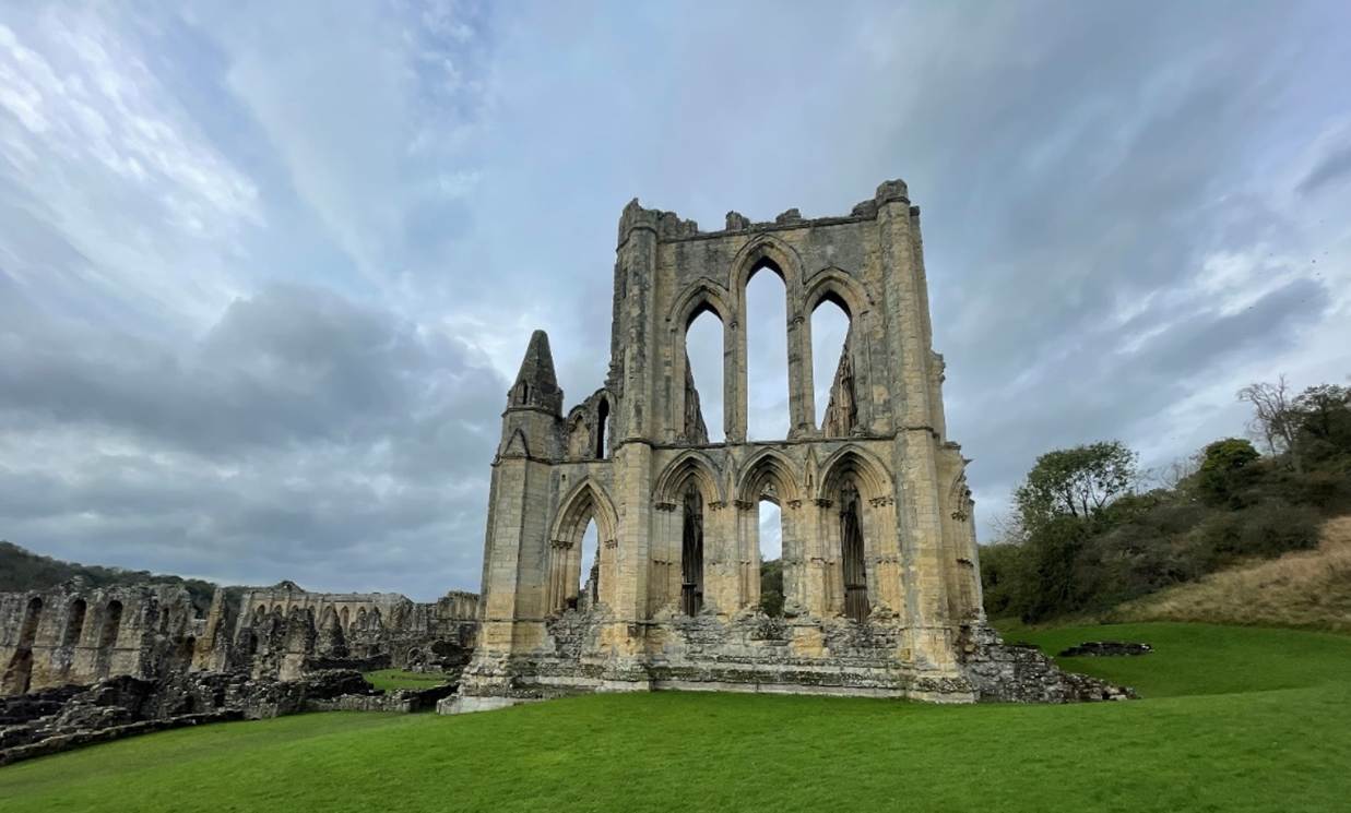 A stone building with arches and windows
Description automatically generated with medium confidence