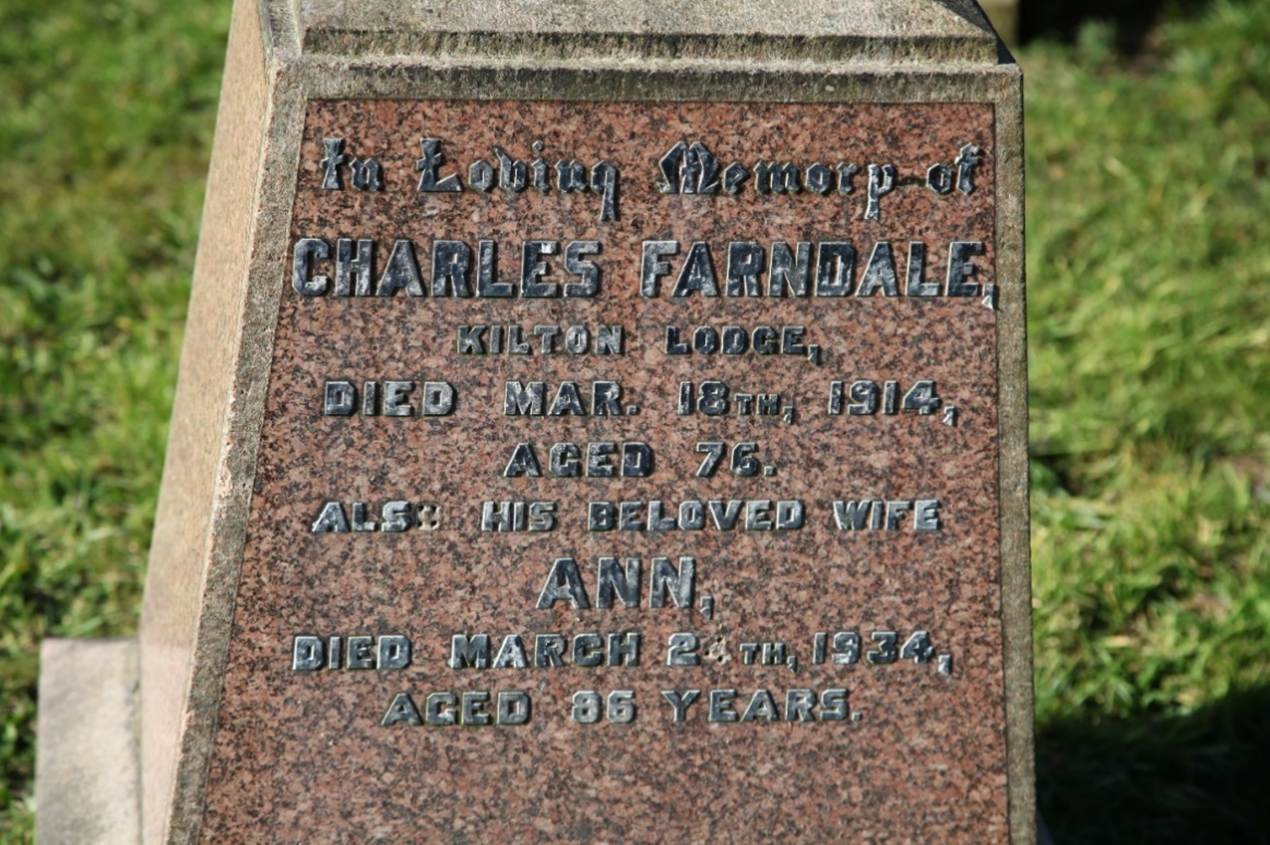 A close-up of a grave stone
Description automatically generated