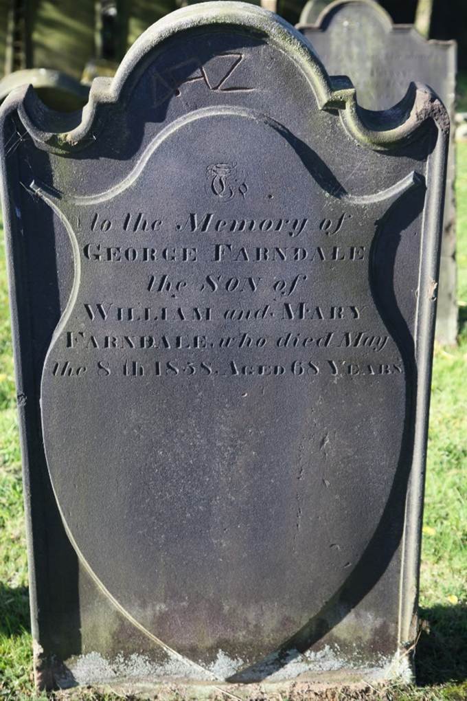 A close-up of a grave stone
Description automatically generated