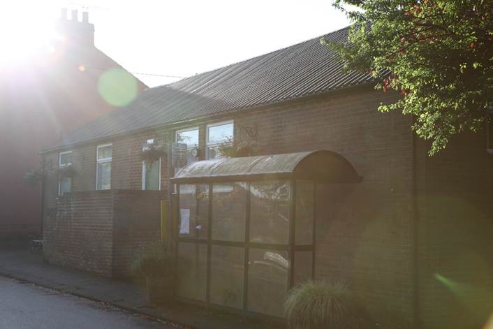 A building with a awning
Description automatically generated