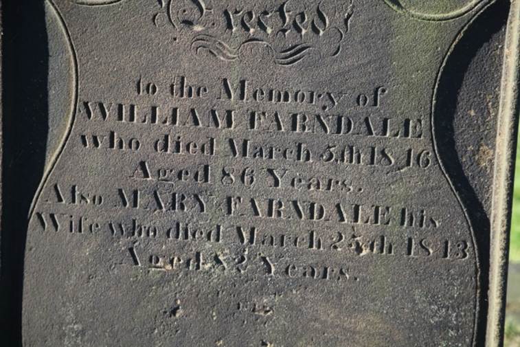 Close-up of a grave stone
Description automatically generated