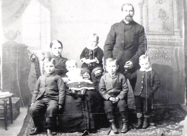 A group of people posing for a photo
Description automatically generated