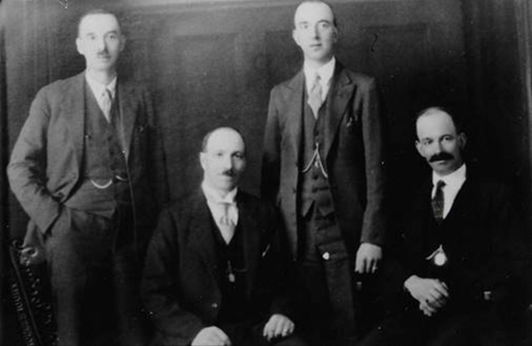 A group of people posing for a photo
Description automatically generated