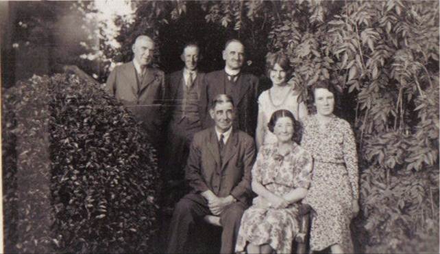 A group of people posing for a photo
Description automatically generated