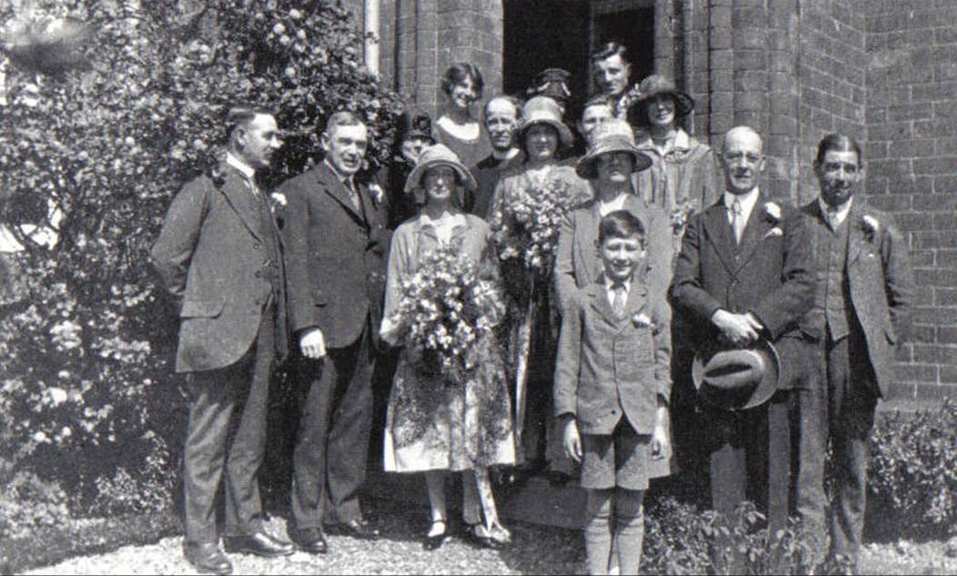 A group of people standing outside a building