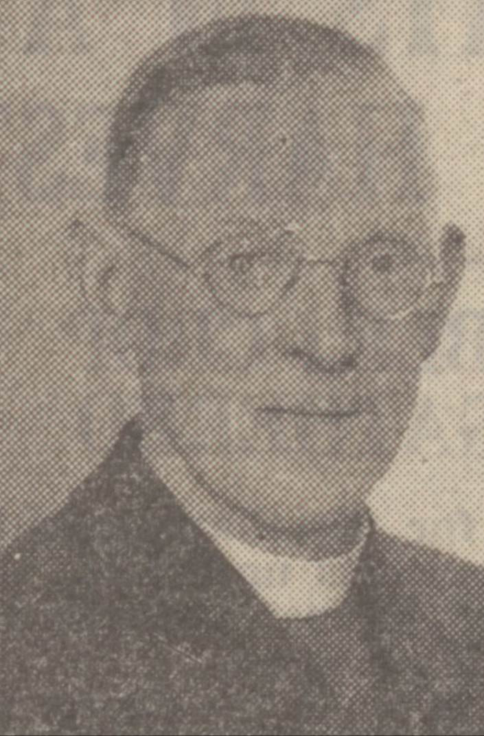 A person wearing glasses and a collared shirt
Description automatically generated