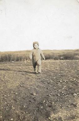 A person standing in a field
Description automatically generated with low confidence