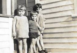 A group of children standing outside a building
Description automatically generated with low confidence