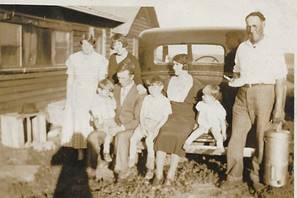 A picture containing outdoor, standing, old, group
Description automatically generated