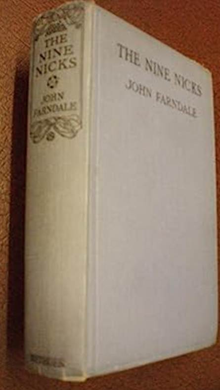 A white book on a brown surface
Description automatically generated
