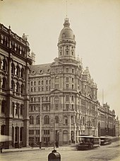 A large building with a dome on top

Description automatically generated