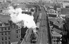 A train going down a train track
Description automatically generated