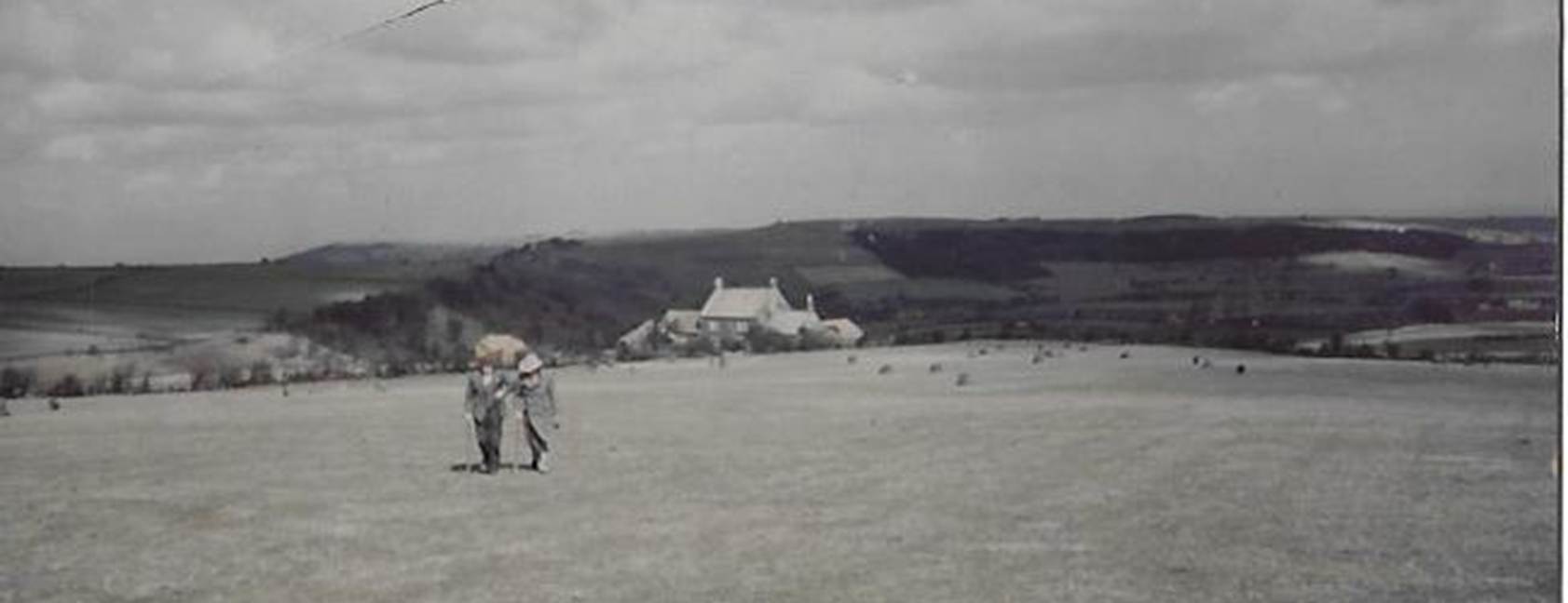 A group of people standing on top of a sandy beach
Description automatically generated